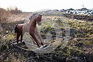 Old thrown away rocking horse