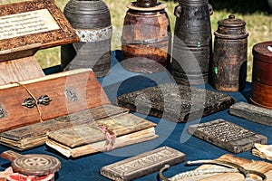 Old Tibetan praying books and milk wooden containers in display