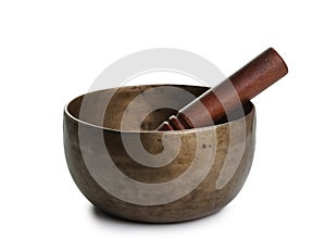 Old Tibetian singing bowl on white
