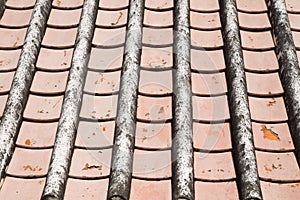 Old tile roof texture. Weathered surface of ancient roof