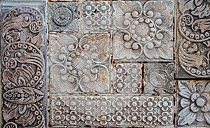 Old tile texture of metal flowers rusting away