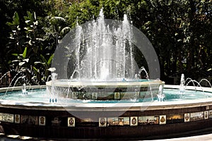 Old tiled fountain in Plaza la Alameda Marbella Spain photo