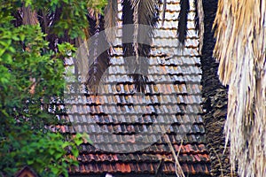 An old tiled roof, which used to be red, on a street in Hadera in northwestern Israel.