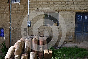 Old tiles near a house made of clay blocks, old town of Cuzco