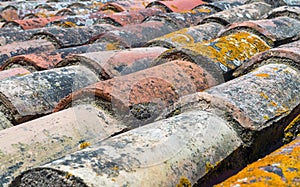 Old tiles of a roof with moss