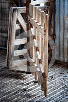 Old timber gate inside an abandoned and derelict shearing shed