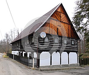 Old timbered house with white wooden bottom