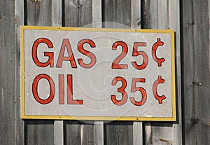 Old time sign with gas and oil prices