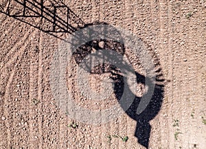 Old time windmill in field with shadow .