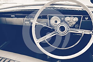 Old timer car steering wheel and dashboard