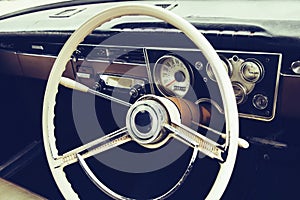 Old timer car steering wheel and dashboard