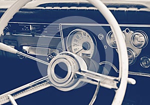 Old timer car steering wheel and dashboard