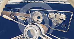 Old timer car steering wheel and dashboard