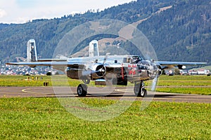 Old timer warbird at air base and airfield. Cold war and World War aviation. Airshow display. Aged military warplane aircraft. Fly photo