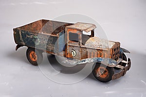 old tin cargo truck tin toy from the year 1950 faded profile