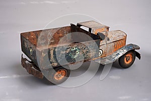 old tin cargo truck tin toy from the year 1950 faded profile