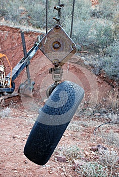 Old tire on the crane hook