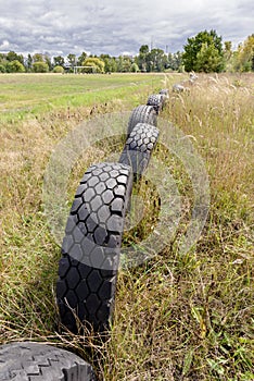 Old Tires Around a Football Field