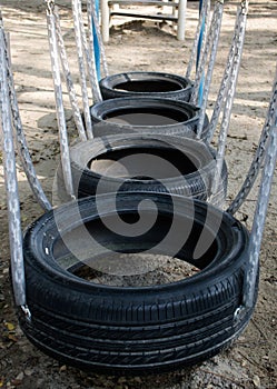 Old tires on kids playground.