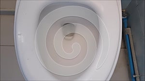 Old Toilet flushes and clean water drops