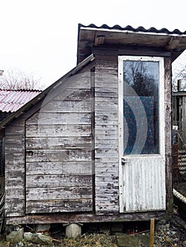 An old toilet wooden outhouse privy in the garden