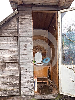 An old toilet wooden outhouse privy in the garden