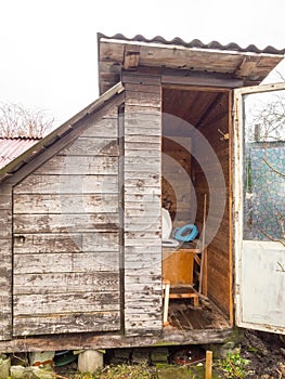 An old toilet wooden outhouse privy in the garden