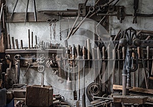 The old tools in an ancient smithy photo