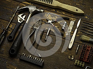 Old tools over a wood background