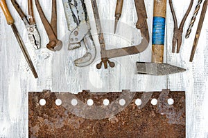 Old tools and rusty metal sheet
