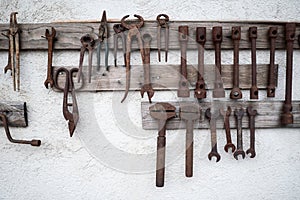 Old tools on a white wall