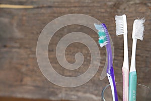 Old toothbrush Old, cracked wood background