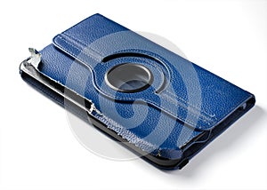 Old torn blue tablet case. White background. Close up