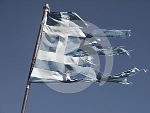 Old and torn flag of Greece