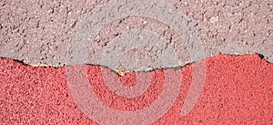 Old torn red rubber crumb cover, treadmill or running track surface outdoor playground stadium texture background.