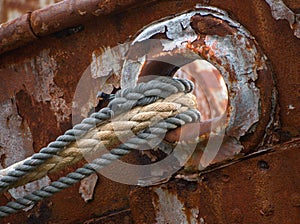 Old almost torn ship ropes on fisher boat wreck