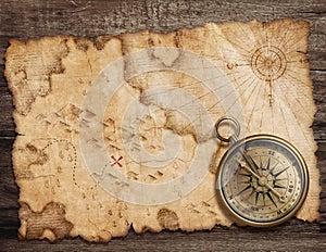 Old torn treasure map with compass . Adventure and travel concept. Mixed media.