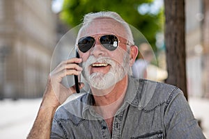 Old tourist man use internet app to speak in roaming