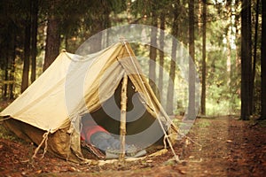 Old tourist tent and dead body in it