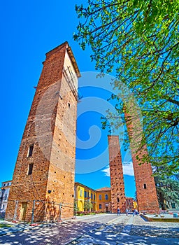 Old towers on Piazza Leonardo da Vinci in center of Pavia, Italy