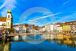 Old town buildings and bridge over River Reuss in Lucerne city in Switzerland