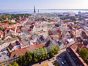 Old town, castle, and medieval towers  of Tallinn in Estonia with Raekoja plats under the sunlight