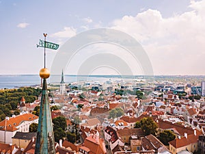 Old town, castle, and medieval towers  of Tallinn in Estonia with Raekoja plats under the sunlight