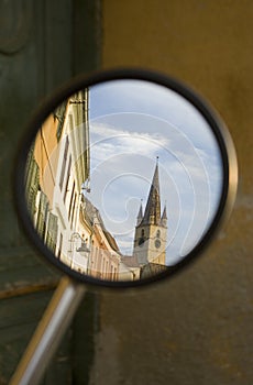 Old town church of Sibiu refecting in a mirror