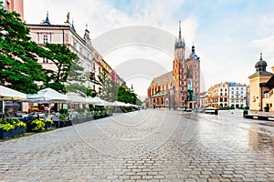 Old town of Cracow, Poland with St. Mary's Basilica and restaurants