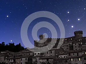 Old town dominated by castle at night