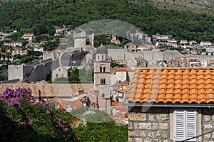 Old town of Dubrovnik with a view from the wall to the red roofs