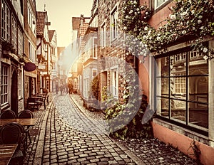 Old town in Europe at sunset with retro vintage filter effect