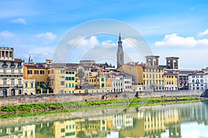 The old town of Florence, Tuscany, Italy located along Arno river. Reflection of the buildings in the water. Historical center.