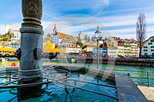 Old town fountain over the Reuss river in Lucerne old Town, Switzerland